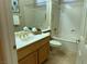 Bathroom features a single sink vanity, a mirror, and a shower and tub combo at 2715 Riceville Dr, Henderson, NV 89052