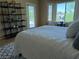 Bedroom featuring tile floors, a queen bed, and plenty of natural light at 2715 Riceville Dr, Henderson, NV 89052