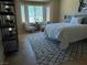 Cozy bedroom features tile floors, a patterned rug, and modern furniture at 2715 Riceville Dr, Henderson, NV 89052
