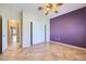 Bedroom includes a ceiling fan, closet, and contrasting neutral and accent-colored walls at 2715 Riceville Dr, Henderson, NV 89052