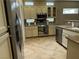 Bright kitchen with stainless steel appliances, granite countertops, and ample cabinet space at 2715 Riceville Dr, Henderson, NV 89052