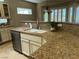 Kitchen sink and granite countertops at 2715 Riceville Dr, Henderson, NV 89052