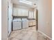 The laundry room features a washer, a dryer, and plenty of cabinet space at 2715 Riceville Dr, Henderson, NV 89052
