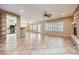 Open-concept living room features tiled floors, a fireplace, and plenty of natural light at 2715 Riceville Dr, Henderson, NV 89052