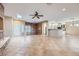 Spacious living room featuring tile floors, a fireplace, and a built-in bookshelf at 2715 Riceville Dr, Henderson, NV 89052