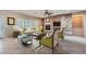 Inviting living room with fireplace, tile floor, ceiling fan, and comfortable seating at 2715 Riceville Dr, Henderson, NV 89052