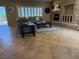 Cozy living room featuring a stone fireplace and neutral color palette at 2715 Riceville Dr, Henderson, NV 89052