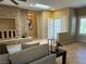 Comfortable living room with stone fireplace, perfect for relaxing and entertaining at 2715 Riceville Dr, Henderson, NV 89052