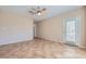 Bright living room featuring neutral walls, ceiling fan, and tile flooring, creating a welcoming space at 2715 Riceville Dr, Henderson, NV 89052