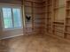 Home office with custom built-in bookshelves and tile flooring, great for remote work at 2715 Riceville Dr, Henderson, NV 89052