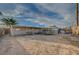 Wide backyard view showing space for outdoor entertaining with ample space and desert landscaping at 2716 Saint George St, North Las Vegas, NV 89030