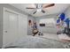 Bedroom featuring twin beds, ceiling fan, closet, and window at 2716 Saint George St, North Las Vegas, NV 89030