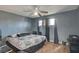 Cozy bedroom with natural light, unique flooring, and a comfortable bed at 2716 Saint George St, North Las Vegas, NV 89030