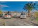 The property with a driveway, vehicles, and a modest single-story home at 2716 Saint George St, North Las Vegas, NV 89030