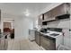 Open kitchen with appliances, adjacent to a cozy living room at 2716 Saint George St, North Las Vegas, NV 89030