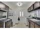 Functional kitchen with ample counter space, modern appliances, and tiled flooring at 2716 Saint George St, North Las Vegas, NV 89030