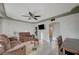 Inviting living area with tile floors, ceiling fan, and a glimpse into the kitchen at 2716 Saint George St, North Las Vegas, NV 89030