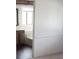 Bathroom with a large bathtub, window, vanity, and wood-look floors at 3231 Comitan Ln, Las Vegas, NV 89122