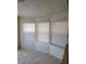 Bright room with carpeted floors and three windows, providing ample natural light at 3231 Comitan Ln, Las Vegas, NV 89122
