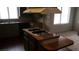 Kitchen with wood-look flooring and a center island with an electric cooktop at 3231 Comitan Ln, Las Vegas, NV 89122