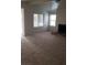Bright living room boasting a fireplace, sliding glass door, and ample natural light at 3231 Comitan Ln, Las Vegas, NV 89122
