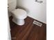 Bathroom with a modern toilet and wood-look floors at 3231 Comitan Ln, Las Vegas, NV 89122