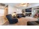 Comfortable living room with plush seating, a ceiling fan, and a decorative fireplace at 3661 Margarita Way, Las Vegas, NV 89103