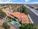 The backyard of the house features a pool and landscaping, also nearby city views at 42 Sawgrass Ct, Las Vegas, NV 89113