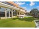 Stunning backyard featuring a pool, lush lawn, and a built-in outdoor grill for entertaining at 42 Sawgrass Ct, Las Vegas, NV 89113