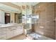 Sleek bathroom featuring a glass shower and modern vanity with ample counter space at 42 Sawgrass Ct, Las Vegas, NV 89113