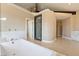 Elegant bathroom with soaking tub, walk-in shower, and marble accents at 42 Sawgrass Ct, Las Vegas, NV 89113