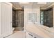 Elegant bathroom featuring double sinks, a glass shower, and contemporary fixtures at 42 Sawgrass Ct, Las Vegas, NV 89113