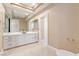 Bright bathroom with marble countertops and modern, vessel sink at 42 Sawgrass Ct, Las Vegas, NV 89113