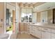 Modern bathroom with vanity and a window offering outdoor views and natural light at 42 Sawgrass Ct, Las Vegas, NV 89113