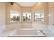 Bathroom featuring a relaxing soaking tub with great views at 42 Sawgrass Ct, Las Vegas, NV 89113