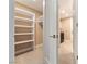 Well-organized walk-in closet with shelving and access to the laundry room at 42 Sawgrass Ct, Las Vegas, NV 89113