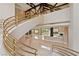 Grand foyer with spiral staircase, tile floors, and views to the living area and landscaped grounds at 42 Sawgrass Ct, Las Vegas, NV 89113