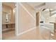 Hallway to living area and a partial bath showcasing modern minimalist design elements and tile floors at 42 Sawgrass Ct, Las Vegas, NV 89113