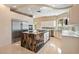 Modern kitchen features a large island, stainless steel appliances, and marble accents at 42 Sawgrass Ct, Las Vegas, NV 89113