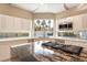 Bright kitchen featuring a central island with gas cooktop, stainless steel microwave and plenty of windows at 42 Sawgrass Ct, Las Vegas, NV 89113