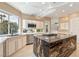Modern kitchen features a large island, stainless steel appliances, and white cabinetry at 42 Sawgrass Ct, Las Vegas, NV 89113
