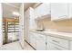 Functional laundry area with sink, cabinets, and direct access to the garage at 42 Sawgrass Ct, Las Vegas, NV 89113