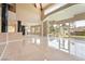 Open living area boasts marble floors, high ceilings, and abundant natural light at 42 Sawgrass Ct, Las Vegas, NV 89113