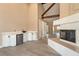Open living room features wet bar, fireplace, and wood beam architecture at 42 Sawgrass Ct, Las Vegas, NV 89113