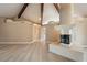 Open living room with wood beam and marble fireplace features modern design at 42 Sawgrass Ct, Las Vegas, NV 89113