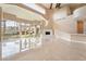 Bright, modern living room featuring a fireplace and access to the outdoor area at 42 Sawgrass Ct, Las Vegas, NV 89113
