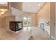 Bright living room boasts modern fireplace, wet bar, and backyard access at 42 Sawgrass Ct, Las Vegas, NV 89113