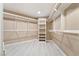 Walk-in closet with custom shelving and hardwood flooring at 42 Sawgrass Ct, Las Vegas, NV 89113