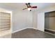 The bedroom features plank flooring, a ceiling fan, and sliding closet doors at 4464 Halbert Ave, Las Vegas, NV 89110