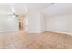 Open-concept living space with tile floors, connecting seamlessly to the kitchen at 4464 Halbert Ave, Las Vegas, NV 89110